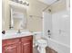Bathroom featuring a single sink vanity, tile flooring, and a combination tub and shower at 11936 Esty Way, Carmel, IN 46033