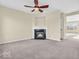 Bedroom showcasing neutral walls, fan, and a fireplace at 11936 Esty Way, Carmel, IN 46033