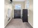 Walk-in closet featuring two windows and shelving and dark wood dressers at 11936 Esty Way, Carmel, IN 46033