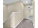 Hallway with carpeting leading to the upper level rooms with a large window at 11936 Esty Way, Carmel, IN 46033