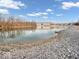 Picturesque pond view with calm waters and a rock shoreline at 11936 Esty Way, Carmel, IN 46033
