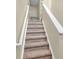 Carpeted stairway with white trim leading upwards at 11936 Esty Way, Carmel, IN 46033