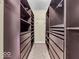 Walk-in closet with installed shelves and storage drawers at 11936 Esty Way, Carmel, IN 46033