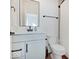Bright bathroom with shower and white vanity with black fixtures at 1208 N Alabama St, Indianapolis, IN 46202