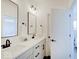 Bright bathroom with double vanity, sleek mirrors, and black hardware accents at 1208 N Alabama St, Indianapolis, IN 46202