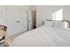 Cozy bedroom featuring a large bed, modern lighting, and an ensuite bathroom at 1208 N Alabama St, Indianapolis, IN 46202