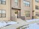 Charming building entrance with a welcoming wreath, brick accents, and well-lit steps at 1208 N Alabama St, Indianapolis, IN 46202