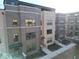 Modern townhomes featuring brick facades, well-lit windows, and tidy landscaping at 1208 N Alabama St, Indianapolis, IN 46202