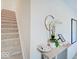 Stylish hallway featuring neutral carpet and a decorative console table with a round mirror at 1208 N Alabama St, Indianapolis, IN 46202