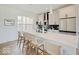 Modern kitchen boasts quartz counters, stainless steel appliances, ample cabinet space, and an island with seating at 1208 N Alabama St, Indianapolis, IN 46202
