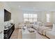 Cozy living room bathed in natural light, featuring a comfortable sectional sofa at 1208 N Alabama St, Indianapolis, IN 46202