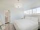 Serene main bedroom with plenty of natural light, showcasing a door into the ensuite bathroom at 1208 N Alabama St, Indianapolis, IN 46202