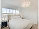 Bright main bedroom features large window, stylish side table and a modern lamp at 1208 N Alabama St, Indianapolis, IN 46202
