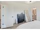 Main bedroom with ensuite access features a dresser and large mirror at 1208 N Alabama St, Indianapolis, IN 46202