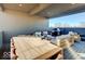 Comfortable covered deck with modern furniture, city view, and an outdoor grill at 1208 N Alabama St, Indianapolis, IN 46202