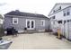 Backyard with a large concrete patio, perfect for entertaining, and easy access into the house at 1208 W 8Th St, Anderson, IN 46016