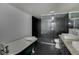 Spacious bathroom showcasing a soaking tub and sleek glass enclosed shower at 1208 W 8Th St, Anderson, IN 46016