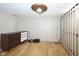 A simple bedroom with hardwood floors and a dresser at 1208 W 8Th St, Anderson, IN 46016