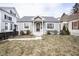 Charming single-story home featuring a welcoming front porch and well-maintained landscaping at 1208 W 8Th St, Anderson, IN 46016