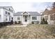 Charming single-story home with neutral siding, well-maintained landscaping, and inviting entrance at 1208 W 8Th St, Anderson, IN 46016