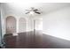 Spacious living room with hardwood floors and open archways to other rooms at 1208 W 8Th St, Anderson, IN 46016