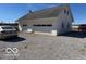 A large, detached, white garage offering plenty of space for vehicles and storage at 13863 N Stiles Rd, Mooresville, IN 46158