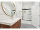 Modern bathroom with vanity, mirror, and shower with black trim at 1804 Spann Ave, Indianapolis, IN 46203