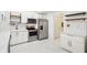 Contemporary kitchen with white cabinets, stainless steel appliances, and marble-patterned floors at 1804 Spann Ave, Indianapolis, IN 46203