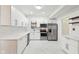 Modern kitchen features white cabinets, stainless steel appliances, and subway tile backsplash at 1804 Spann Ave, Indianapolis, IN 46203