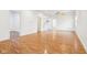 Spacious living room featuring beautiful wood flooring and bright, neutral walls at 1804 Spann Ave, Indianapolis, IN 46203
