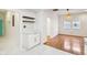 Open living area with hardwood floors and views into the modern, renovated kitchen at 1804 Spann Ave, Indianapolis, IN 46203