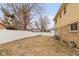 This home features a spacious backyard with a white fence at 2830 Moller Rd, Indianapolis, IN 46224
