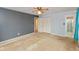 Bedroom featuring a ceiling fan, a large closet, and a bathroom entrance at 2830 Moller Rd, Indianapolis, IN 46224