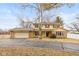 Charming two-story home with a large front yard and attached two-car garage at 2830 Moller Rd, Indianapolis, IN 46224