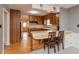 Functional kitchen offering wood cabinetry, laminate countertops, and a breakfast bar area at 2830 Moller Rd, Indianapolis, IN 46224