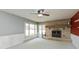 Bright living room featuring a stone fireplace and large windows for ample natural light at 2830 Moller Rd, Indianapolis, IN 46224