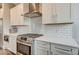 The kitchen features stainless appliances, white cabinets, and quartz countertops at 319 E 16Th E St # 201, Indianapolis, IN 46202
