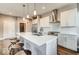 Well-equipped kitchen with white cabinets, subway tile backsplash, and a central island at 319 E 16Th E St # 201, Indianapolis, IN 46202