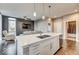 Bright living space with a view, a modern kitchen island, and comfortable seating at 319 E 16Th E St # 201, Indianapolis, IN 46202