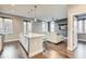 Open-concept living space featuring hardwood floors and a modern kitchen area at 319 E 16Th E St # 201, Indianapolis, IN 46202