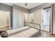 Main bedroom with hardwood floors, exterior access, and access to attached bathroom at 319 E 16Th E St # 201, Indianapolis, IN 46202