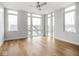 Bright bedroom with multiple windows offering nice views, hardwood floors, and neutral decor at 319 E 16Th St # 302, Indianapolis, IN 46202