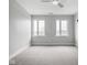 Empty bedroom with carpet, baseboard trim, and natural light from the well placed energy efficient windows at 319 E 16Th St # 302, Indianapolis, IN 46202