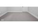 Bedroom featuring neutral carpeting and white trim and baseboards at 319 E 16Th St # 302, Indianapolis, IN 46202