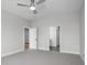 Spacious bedroom featuring neutral color palette, carpeted floors, and an ensuite bathroom at 319 E 16Th St # 302, Indianapolis, IN 46202