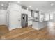 Modern kitchen with stainless steel appliances, a kitchen island with a sink and white cabinets at 319 E 16Th St # 302, Indianapolis, IN 46202