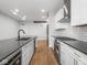Modern kitchen featuring stainless steel appliances, subway tile backsplash, and open layout at 319 E 16Th St # 302, Indianapolis, IN 46202