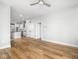 Bright and open living space with hardwood floors, seamlessly connecting to a modern kitchen and hallway at 319 E 16Th St # 302, Indianapolis, IN 46202
