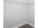 Empty walk-in closet featuring wire shelving and dark tiled floor at 319 E 16Th St # 302, Indianapolis, IN 46202