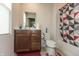 This cozy bathroom features a single vanity, a toilet, and a shower/tub combo with patterned curtain at 3219 E Maygrove Dr, Danville, IN 46122